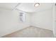 Finished basement with carpet flooring, neutral paint, and a window that provides soft natural light at 2295 S Sherman St, Denver, CO 80210