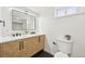 Modern bathroom featuring a double vanity, large mirror, and sleek fixtures at 2295 S Sherman St, Denver, CO 80210