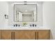 Bright bathroom with a double sink vanity, modern faucets and contemporary mirror at 2295 S Sherman St, Denver, CO 80210