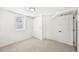 Bright bedroom featuring neutral carpet, closet with sliding doors, and a window at 2295 S Sherman St, Denver, CO 80210