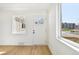 Light and airy entryway with a glass paneled front door and natural wood flooring at 2295 S Sherman St, Denver, CO 80210