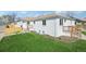 Charming white brick home with a well-maintained lawn and inviting front porch at 2295 S Sherman St, Denver, CO 80210