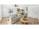 Bright living room with comfortable seating and an open layout connected to the kitchen at 2295 S Sherman St, Denver, CO 80210