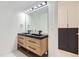 Modern bathroom features a double vanity with sleek fixtures and a large mirror at 10295 E Evans Ave # 114, Aurora, CO 80247