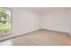 Bedroom features a large window to the outdoors, neutral-tone walls and light colored floors at 10295 E Evans Ave # 114, Aurora, CO 80247