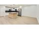 Spacious kitchen featuring a central island, stainless steel appliances, and ample counter space at 10295 E Evans Ave # 114, Aurora, CO 80247