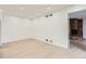 Open living room showcasing new floors leading to a beautiful stone fireplace at 10295 E Evans Ave # 114, Aurora, CO 80247