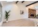 Bright living room featuring a stone fireplace, skylights, vaulted ceilings, and natural light at 10295 E Evans Ave # 114, Aurora, CO 80247