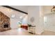 Inviting living room featuring a stone fireplace, skylights, and modern decor at 10295 E Evans Ave # 114, Aurora, CO 80247