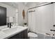 Bright bathroom boasts sleek fixtures, tile walls, and modern design elements at 1277 Quitman St, Denver, CO 80204