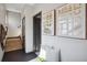 Stylish entryway featuring modern art, a comfortable bench, and an inviting staircase at 1277 Quitman St, Denver, CO 80204