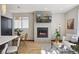 Cozy living room with a fireplace, modern table and chairs, and stylish decor at 1277 Quitman St, Denver, CO 80204
