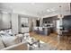 Bright living room featuring modern decor, island seating, and large window at 1277 Quitman St, Denver, CO 80204