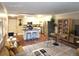 Bright open layout showcasing a modern kitchen and dining area with stylish furnishings and stainless steel appliances at 9300 E Center Ave # 6A, Denver, CO 80247