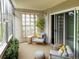 Inviting sunroom with neutral decor, comfortable seating, and plenty of natural light streaming through large windows at 9300 E Center Ave # 6A, Denver, CO 80247