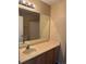 Bathroom featuring a single sink vanity, mirror, and shower with tub at 20304 E 47Th Pl, Denver, CO 80249