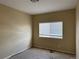This is an empty bedroom featuring neutral walls and a window, ready for personalization at 20304 E 47Th Pl, Denver, CO 80249