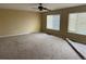 A spacious bedroom with carpet flooring and two large windows, awaiting transformation at 20304 E 47Th Pl, Denver, CO 80249