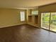 Inviting living room with hardwood floors, built-in shelving, and access to the outdoor patio at 20304 E 47Th Pl, Denver, CO 80249