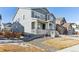 Two-story house with gray siding, landscaping, and wooden fence at 1901 Miranda Rd, Erie, CO 80516