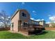 Spacious backyard with a wooden deck, perfect for outdoor entertaining at 495 Bexley St, Highlands Ranch, CO 80126