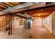 Unfinished basement featuring exposed ceiling and ductwork with utility connections and lighting at 495 Bexley St, Highlands Ranch, CO 80126