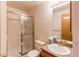 Bathroom featuring shower, sink, toilet and mirror with ample lighting and granite counter at 495 Bexley St, Highlands Ranch, CO 80126