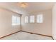 Bedroom featuring three windows that let in natural light at 495 Bexley St, Highlands Ranch, CO 80126