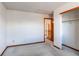 Bedroom with wood trim and an attached closet at 495 Bexley St, Highlands Ranch, CO 80126