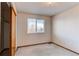 Bedroom with a window that looks out to a tree-lined street at 495 Bexley St, Highlands Ranch, CO 80126