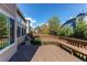 Inviting deck overlooks a spacious backyard with mature trees and landscaping at 495 Bexley St, Highlands Ranch, CO 80126