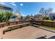 Large wooden deck with built-in seating, ideal for enjoying the backyard view at 495 Bexley St, Highlands Ranch, CO 80126