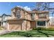 Charming two-story home featuring a two-car garage, well-maintained lawn, and inviting curb appeal at 495 Bexley St, Highlands Ranch, CO 80126