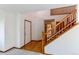 The foyer has a wood staircase and hardwood floors at 495 Bexley St, Highlands Ranch, CO 80126
