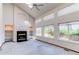 Bright living room with vaulted ceiling, fireplace, and large windows at 495 Bexley St, Highlands Ranch, CO 80126