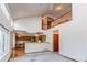 Bright living room area open to the kitchen and upper level at 495 Bexley St, Highlands Ranch, CO 80126