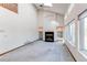 Spacious living room featuring high ceilings, built-in shelving, and fireplace at 495 Bexley St, Highlands Ranch, CO 80126