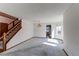 This living room has a wood staircase and large window at 495 Bexley St, Highlands Ranch, CO 80126