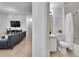 Bathroom seamlessly connected to the living area, featuring modern fixtures and a clean design aesthetic at 12768 Ironstone Way # 204, Parker, CO 80134