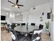 Elegant dining space featuring a modern table, unique chairs, and an open concept layout with views of living room at 12768 Ironstone Way # 204, Parker, CO 80134
