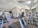 Well-lit fitness center with modern equipment, mirrored walls and ceiling fan at 12768 Ironstone Way # 204, Parker, CO 80134