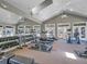 Community fitness center featuring multiple treadmills, weights, and mirrored walls at 12768 Ironstone Way # 204, Parker, CO 80134