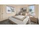 Inviting bedroom with two windows, neutral decor, and well-coordinated furnishings at 2122 S Victor St # F, Aurora, CO 80014