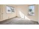 Neutral bedroom with two windows providing natural light at 2122 S Victor St # F, Aurora, CO 80014