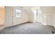 Bedroom featuring two windows and two closets with white doors at 2122 S Victor St # F, Aurora, CO 80014