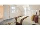 Cozy bedroom under sloped ceilings, featuring carpet and a well appointed bed at 2122 S Victor St # F, Aurora, CO 80014