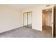 Bedroom featuring mirrored closet doors at 2122 S Victor St # F, Aurora, CO 80014