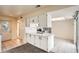 Eat in kitchen boasts white cabinets, updated countertops, and stainless steel appliances at 2122 S Victor St # F, Aurora, CO 80014
