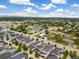 A wide aerial shot exhibits the neighborhood's layout and the vast surrounding landscape at 1340 W 68Th Ave, Denver, CO 80221