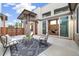 Outdoor patio with stylish furniture, a cozy rug, and a view of the indoor living space at 1340 W 68Th Ave, Denver, CO 80221